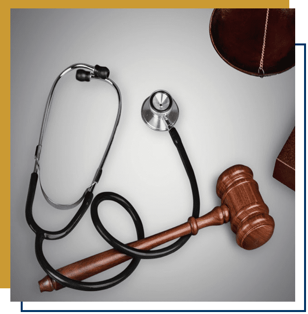 A close-up of a stethoscope wrapped around a court mallet against a white surface.